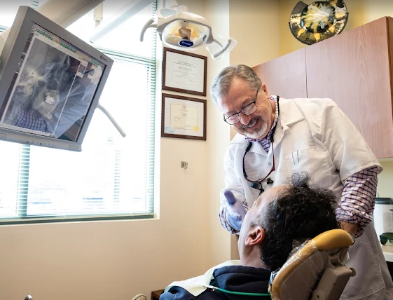Dr Gary Edeer discussing Invisalign treatment with a patient in Wayne NJ