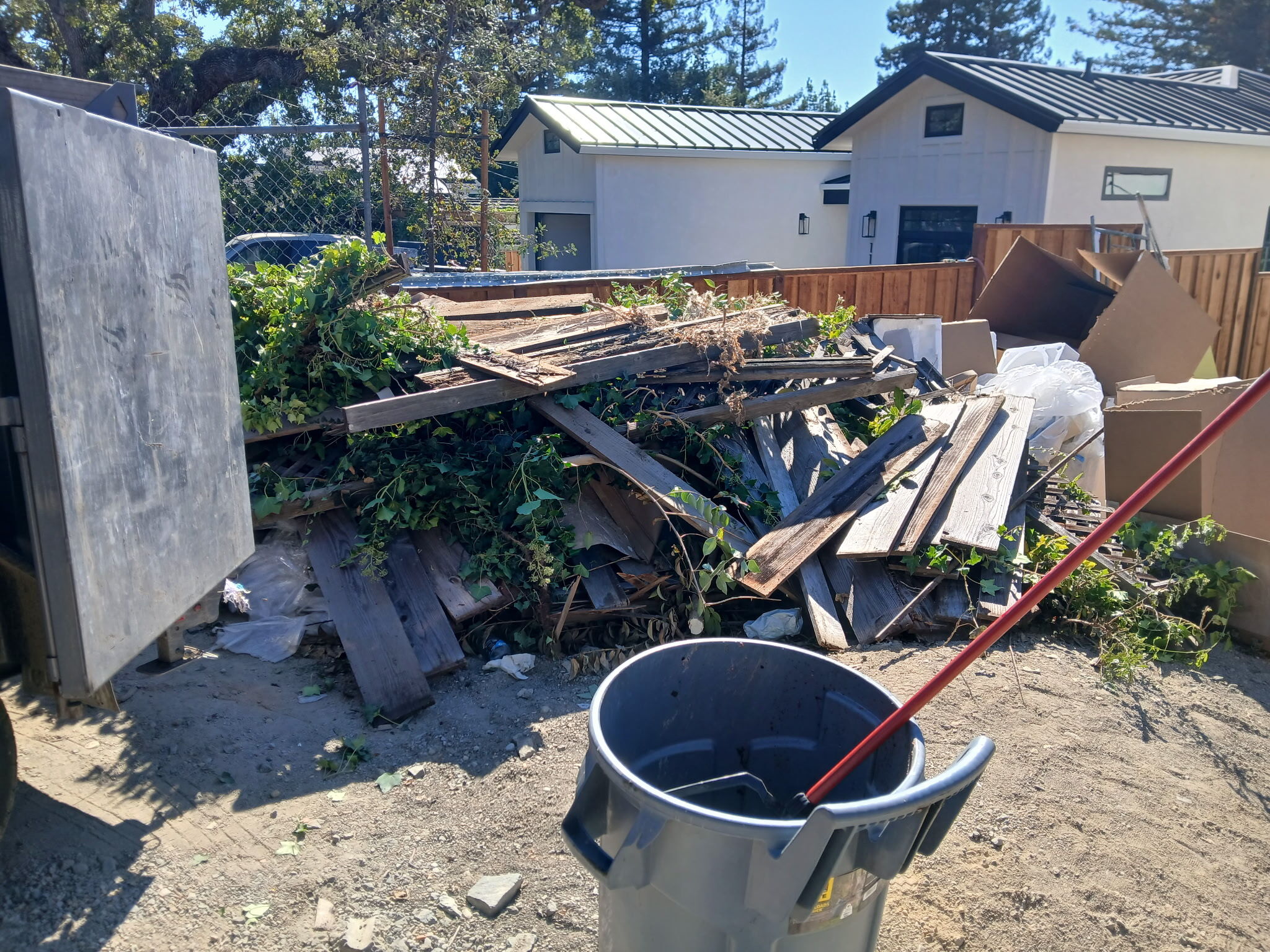 AmPm Junk Removal Service crew completing a local garage cleanout job