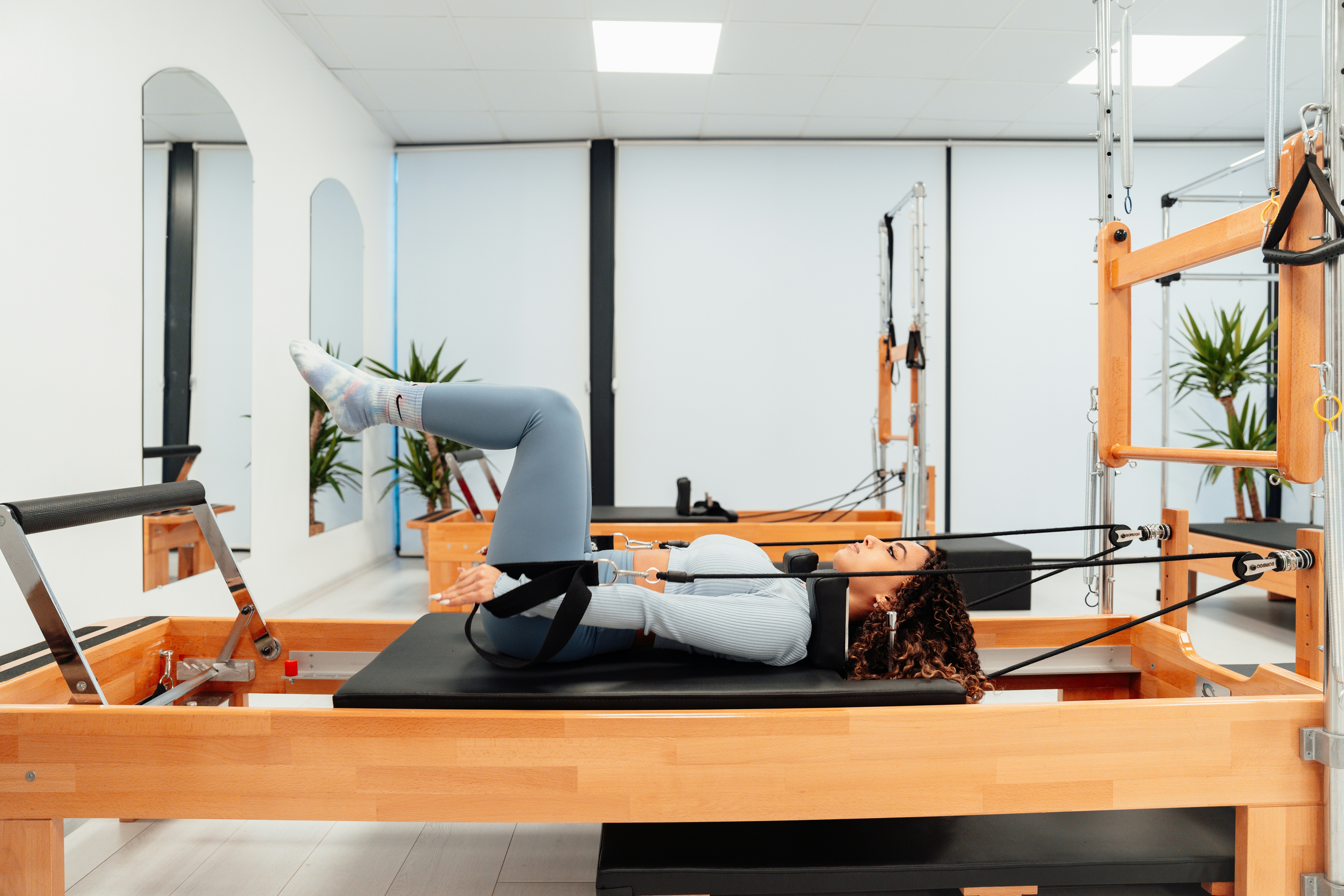 woman on reformer pilates workout wellness