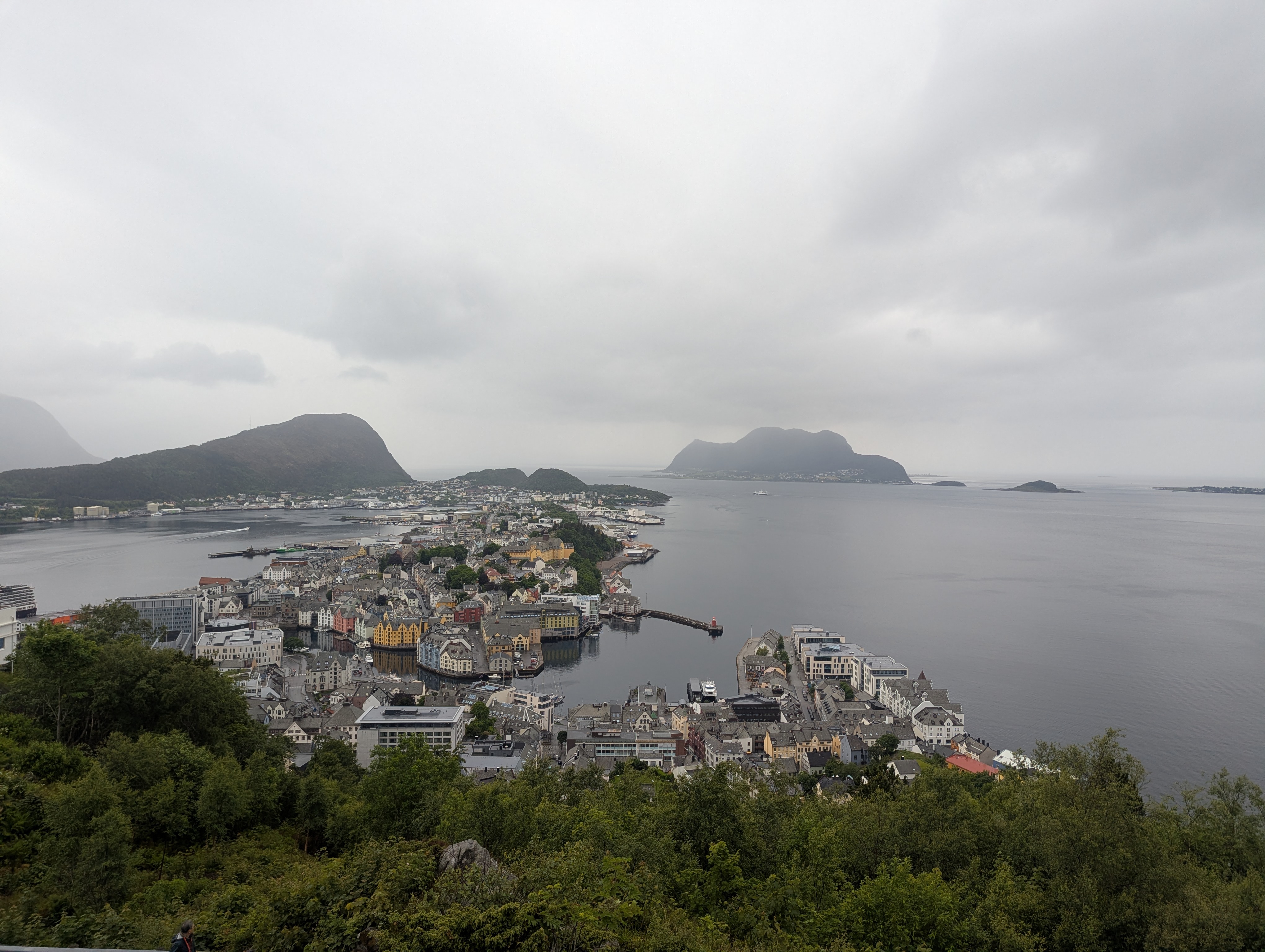 View of Alesund from the top of Aklsla mountain with water and islands in the distance.