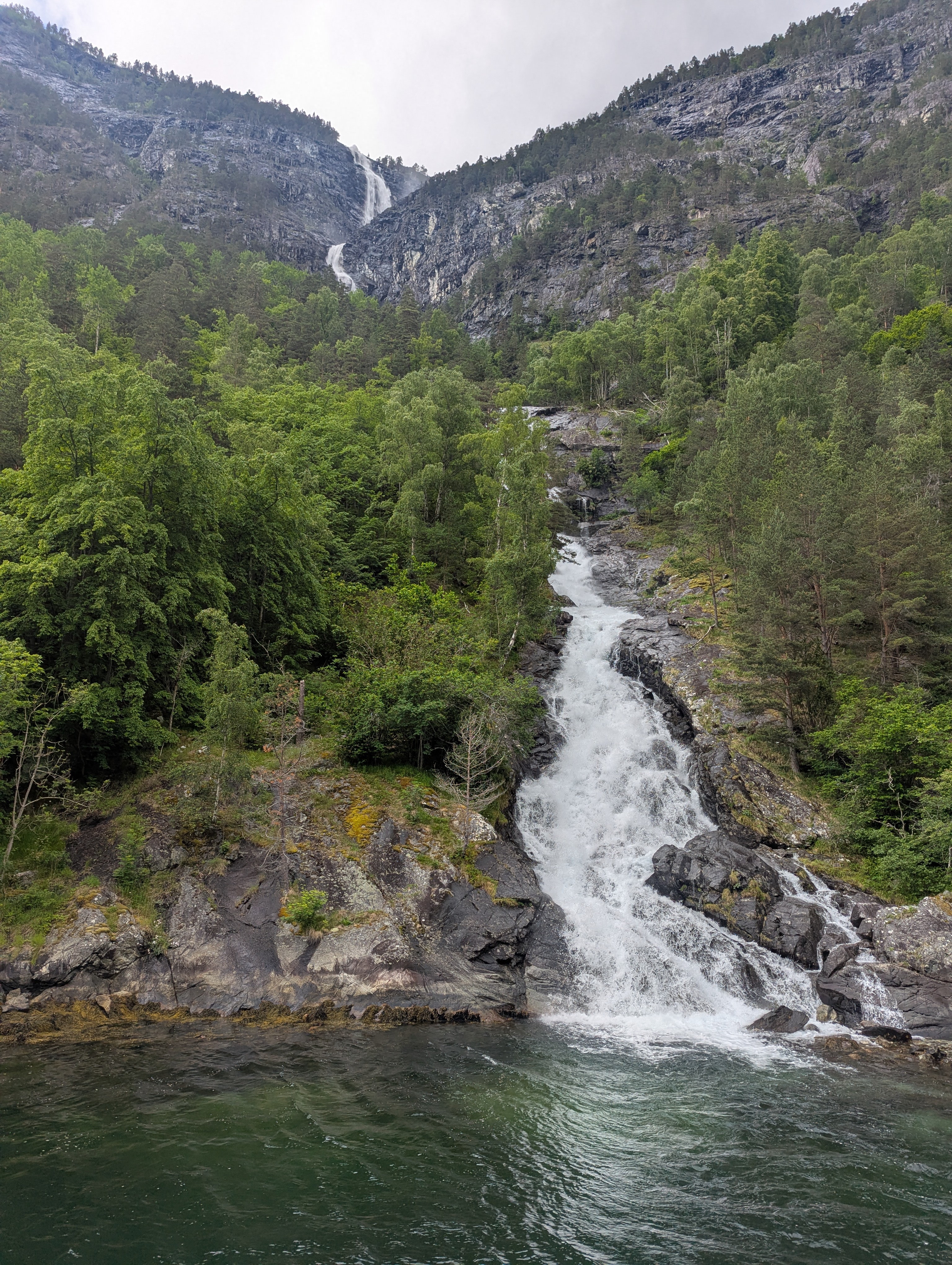 Waterfall as seen from a Norwegian fjord Waterfall as seen from a Norwegian fjord