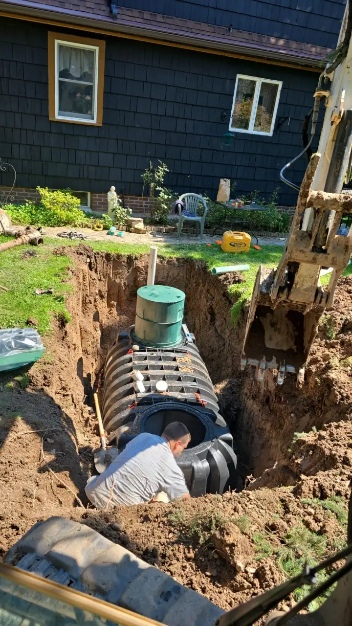 New septic tank being set in a residential yard