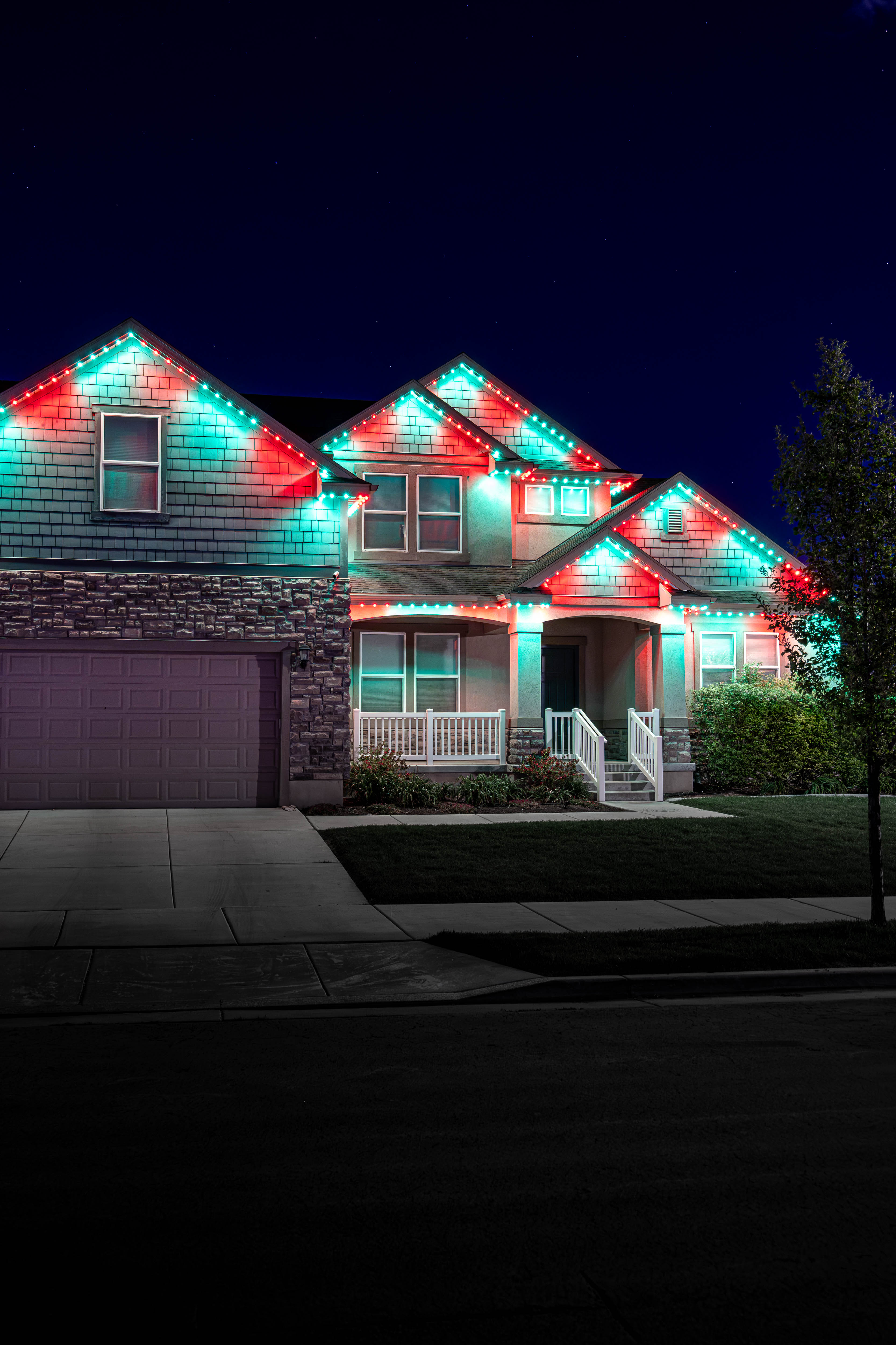 Home with Christmas red and green Trimlight lighting
