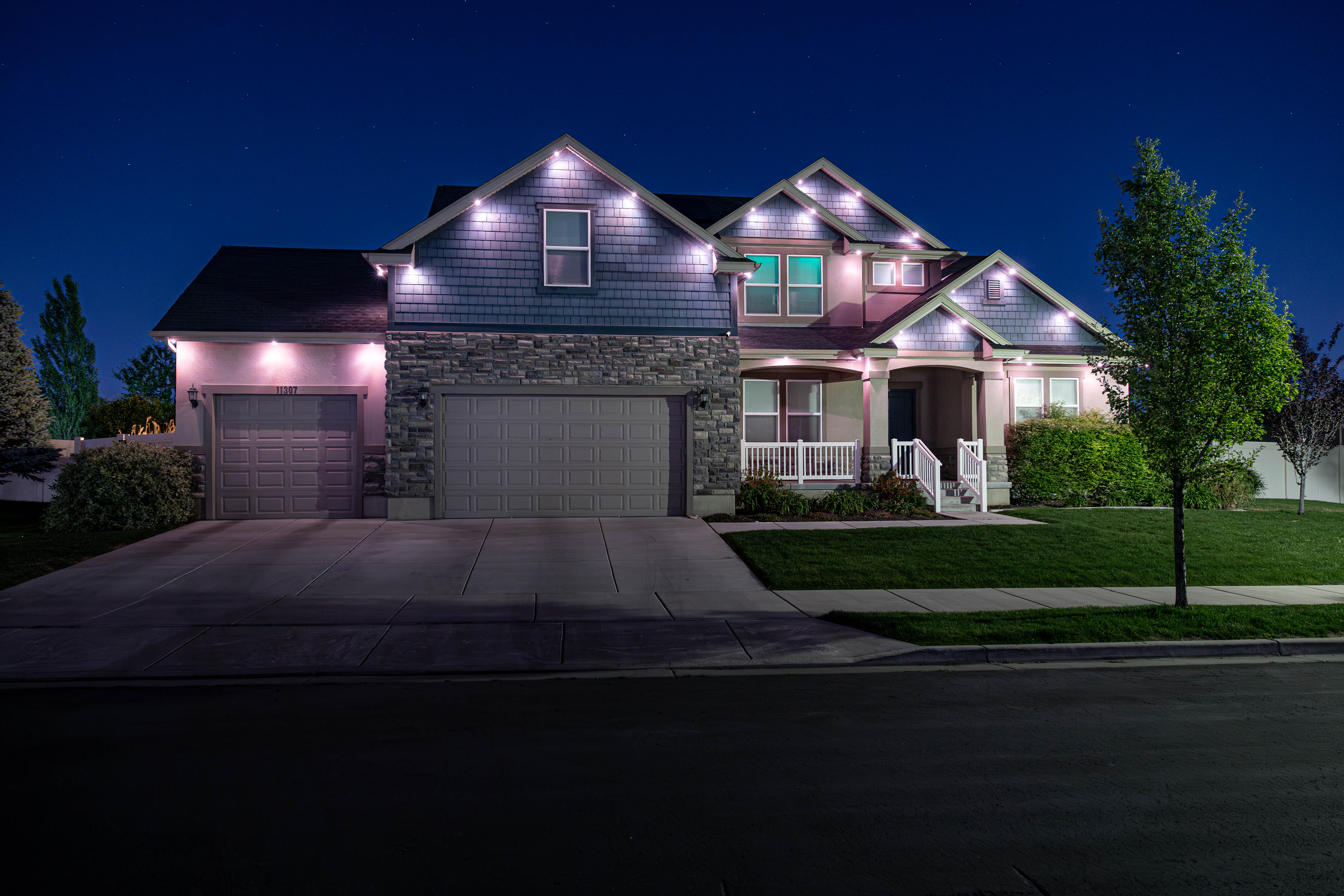 Home with soft pink and purple Trimlight accent lighting