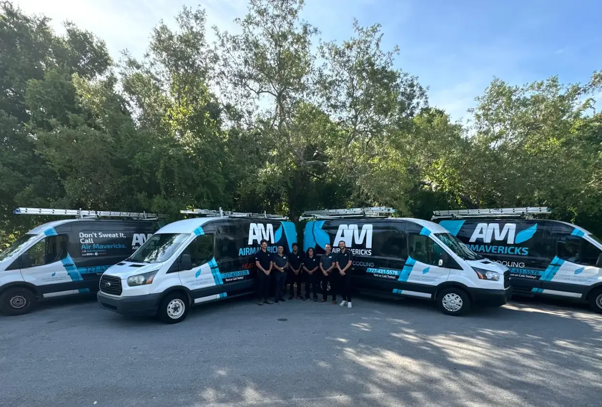 Air Mavericks team standing with their service vans
