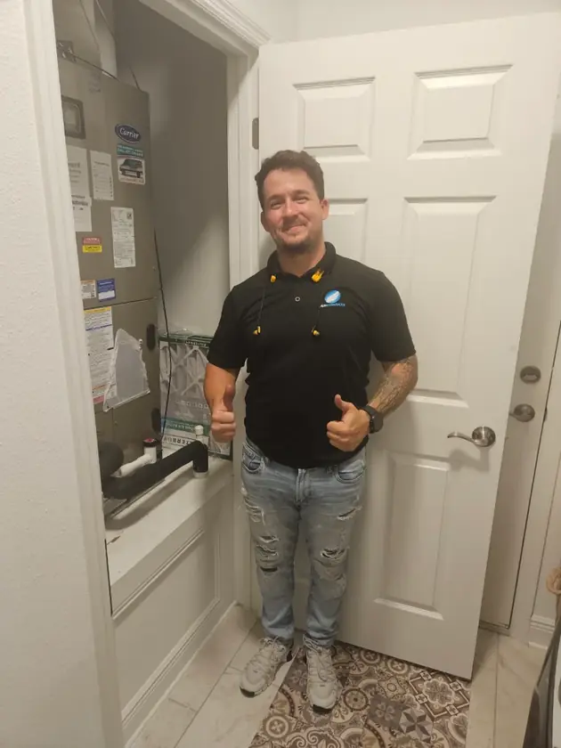 Air Mavericks technician after finishing an indoor air handler job