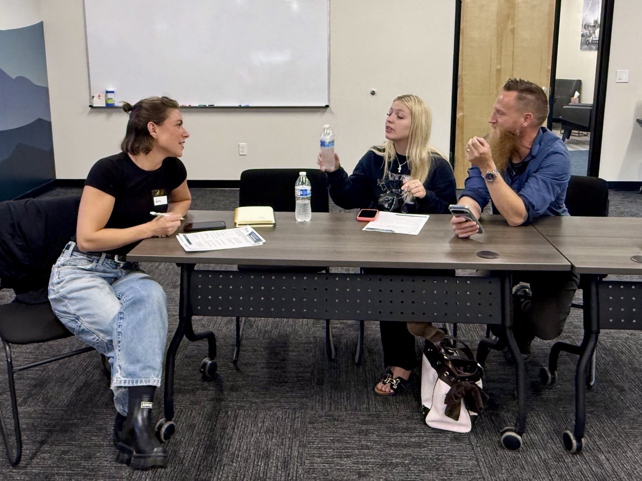 Management Academy participants discussing a workplace scenario