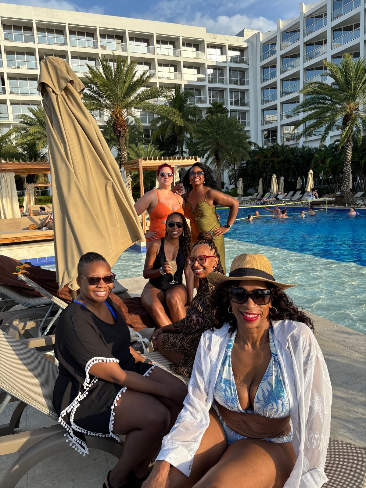 Women relaxing poolside during the WANTED Woman Escape in Cartagena Colombia