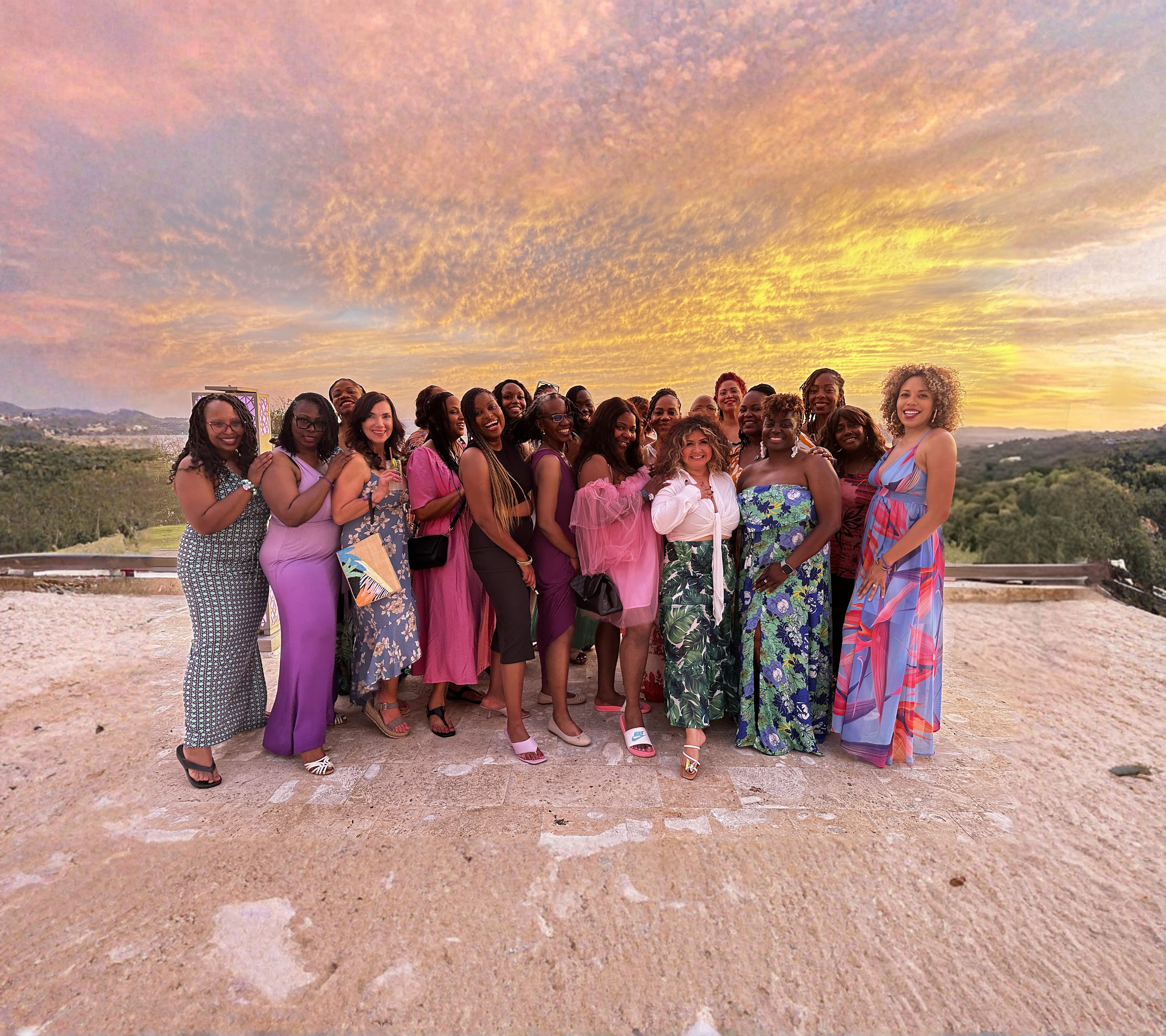 Group of women celebrating together at sunset during the WANTED Woman Escape