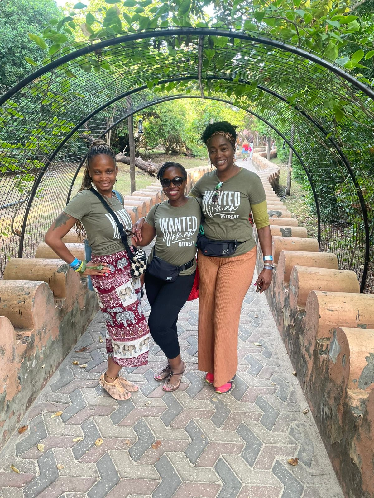 women walking through tropical garden Zanzibar retreat experience
