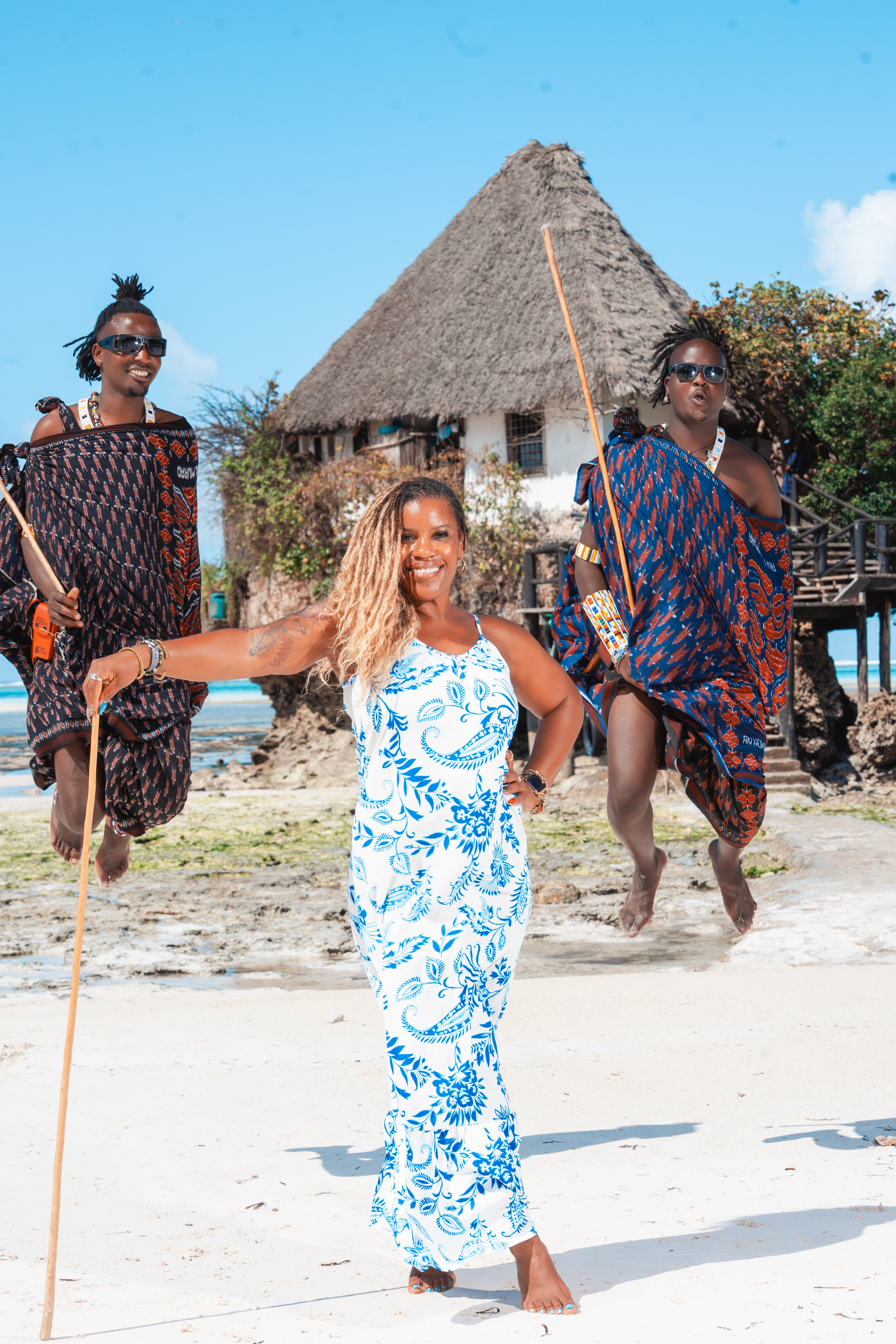 women jumping onwomen standing on Zanzibar beach during WANTED Woman Retreat Zanzibar beach during WANTED Woman Retreat
