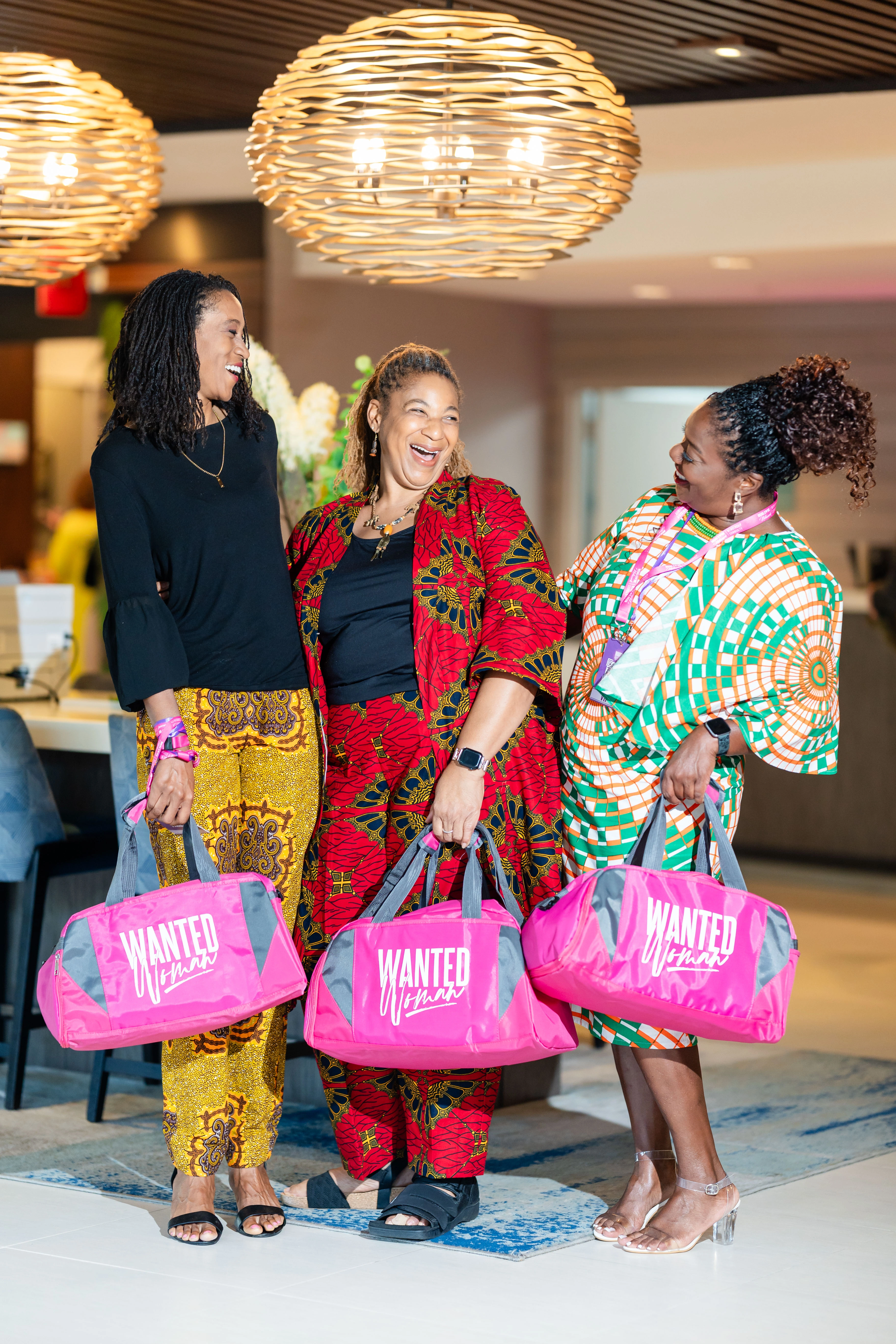 well-dressed Black women posing at WANTED Woman Live event