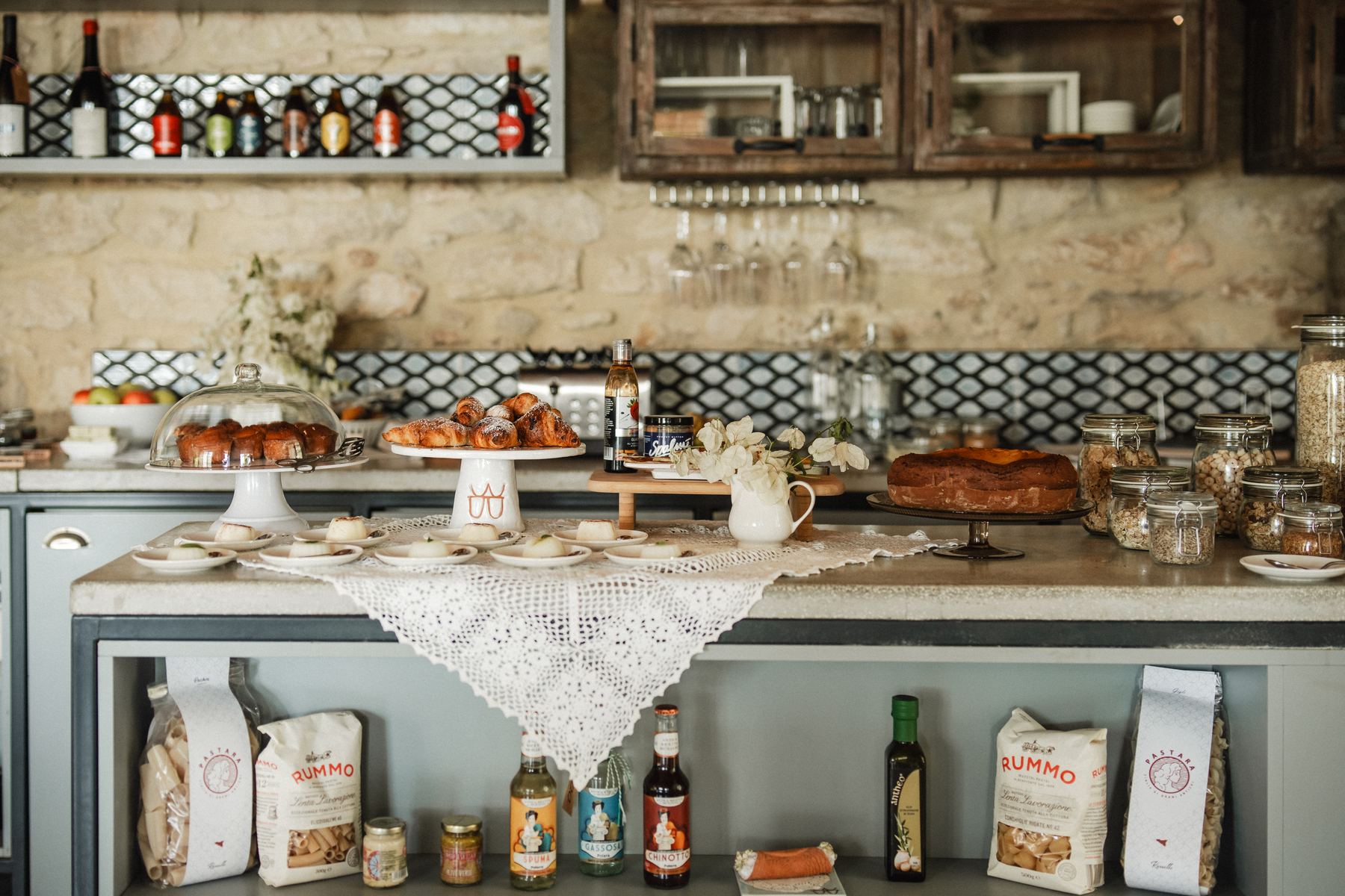 Croissants, cake and Sicilian treats on the kitchen counter