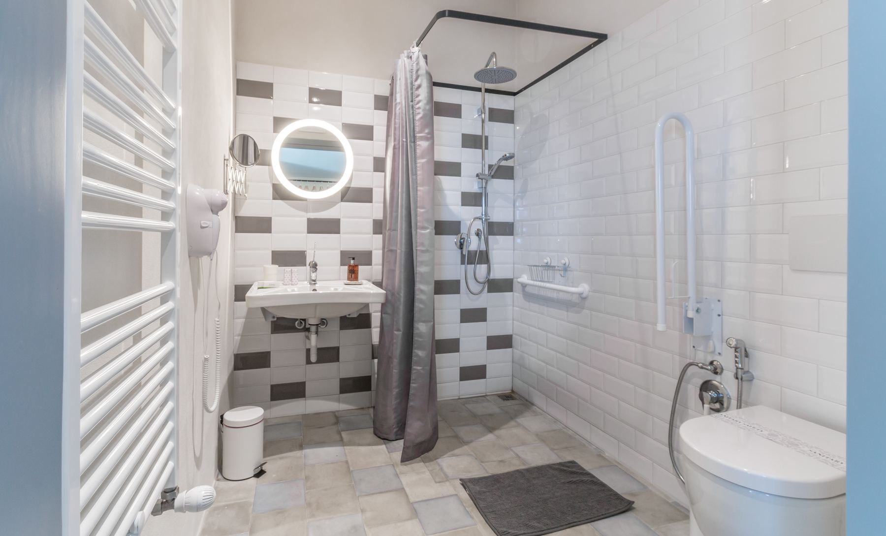 A bright walk-in shower room at Mangiabove