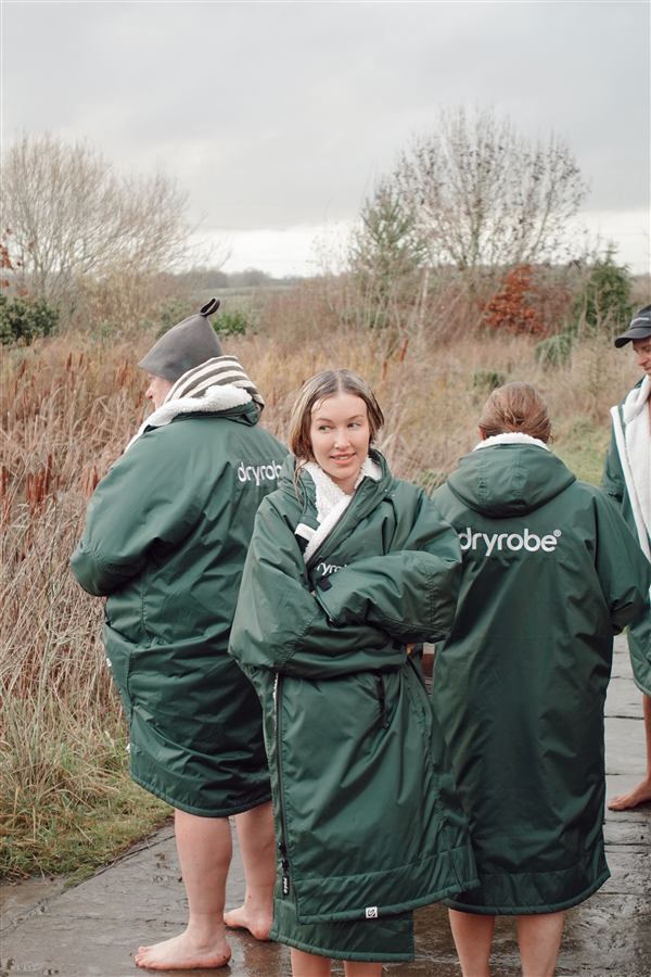 Members in dryrobes on a founder retreat