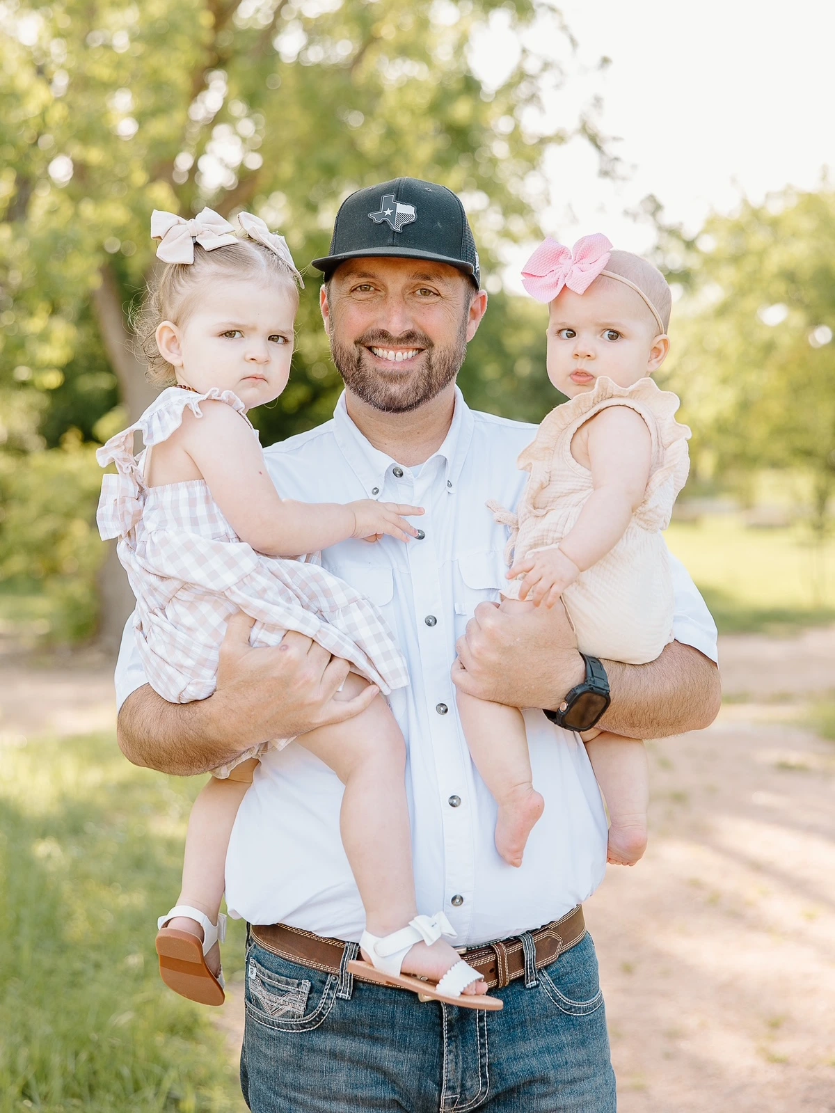 Waco Trailer Company owner holding his two daughters