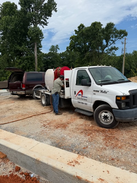 Pest control technician inspecting a commercial building in Central Alabama