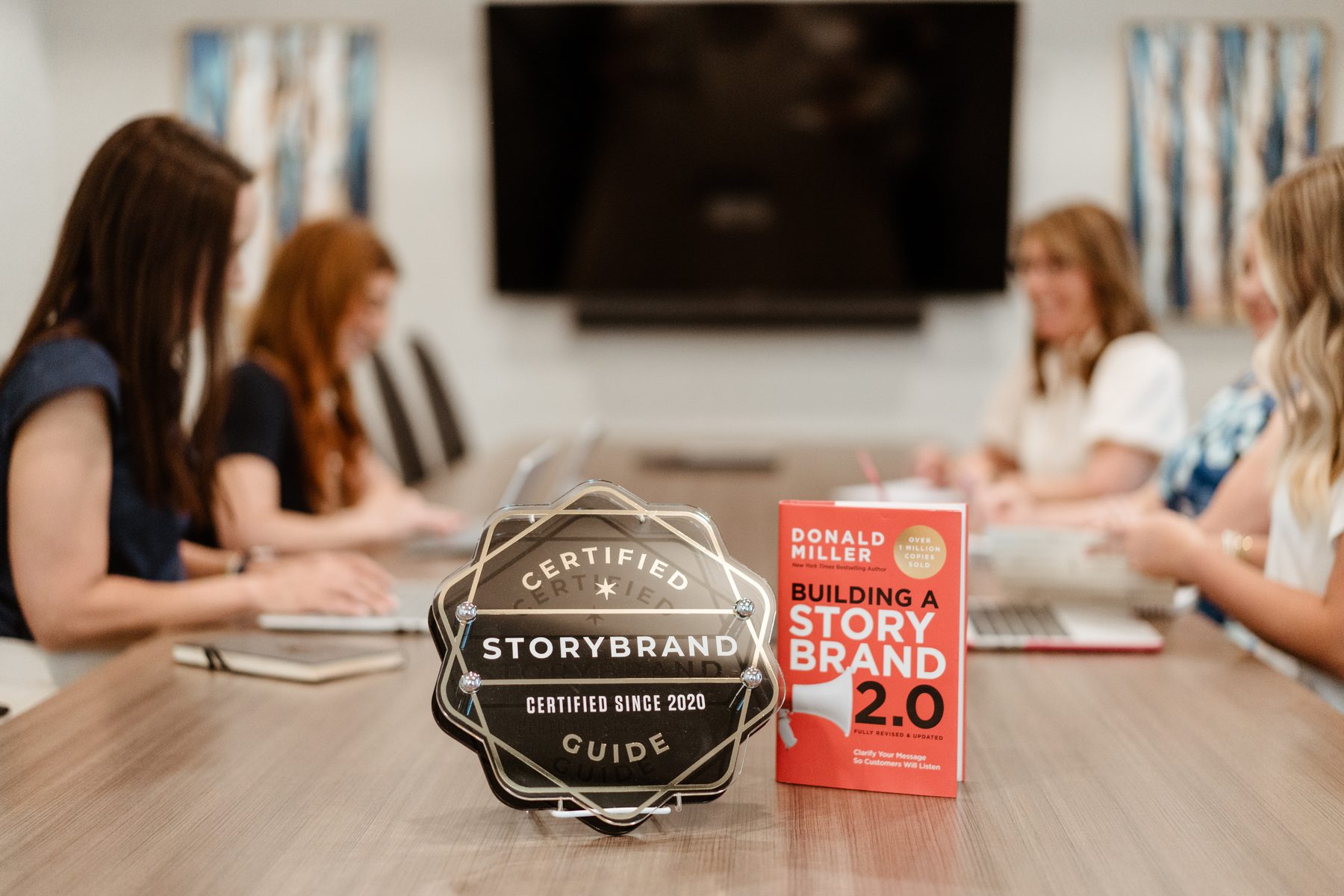 StoryBrand certification displayed in Far Beyond Marketing conference room