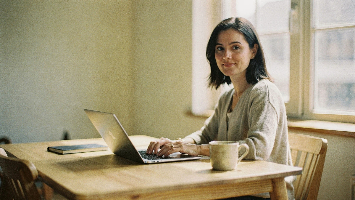woman reviewing an organised workflow automation dashboard on her laptop