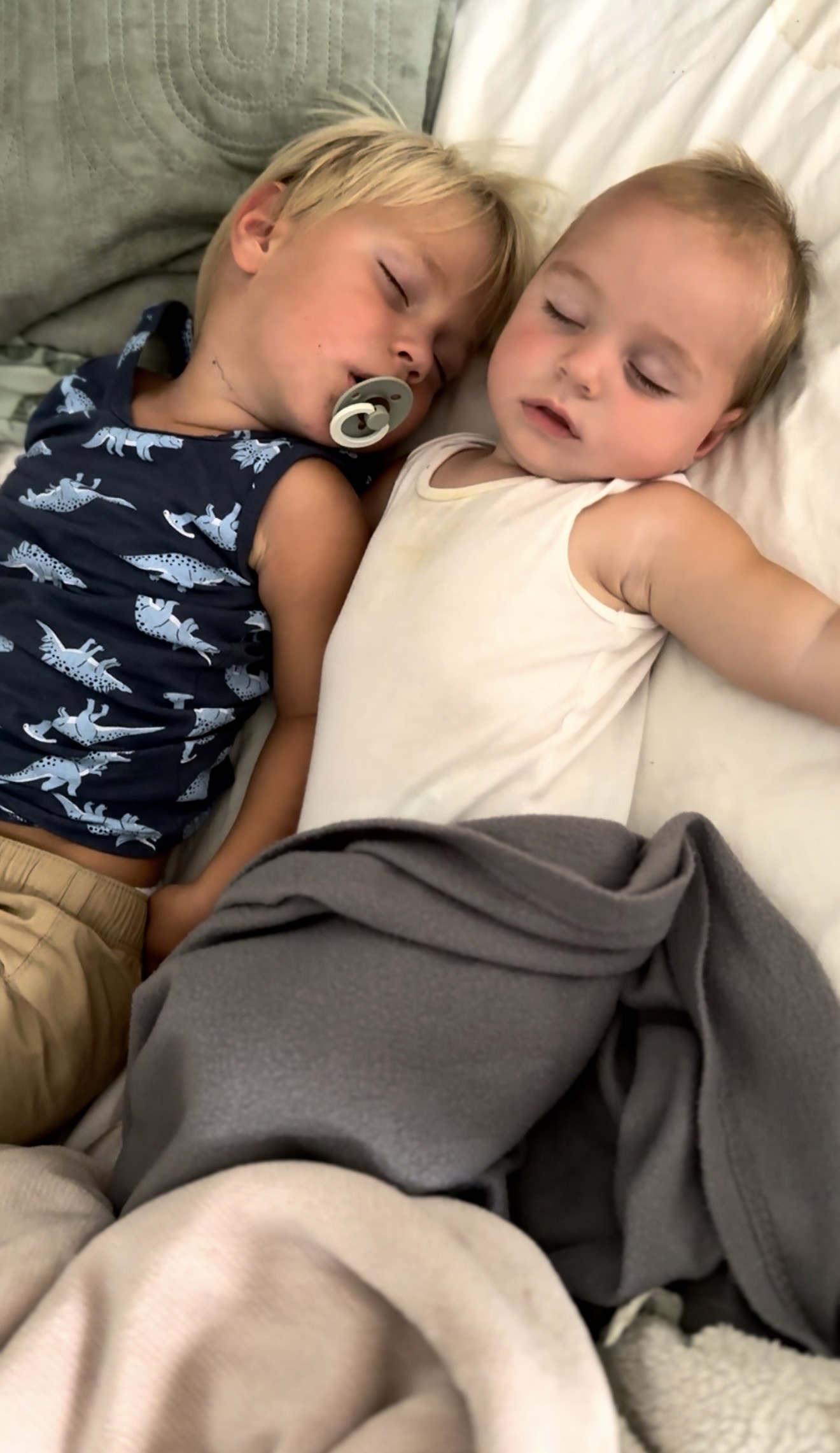 Izabelle's two boys asleep peacefully together at home