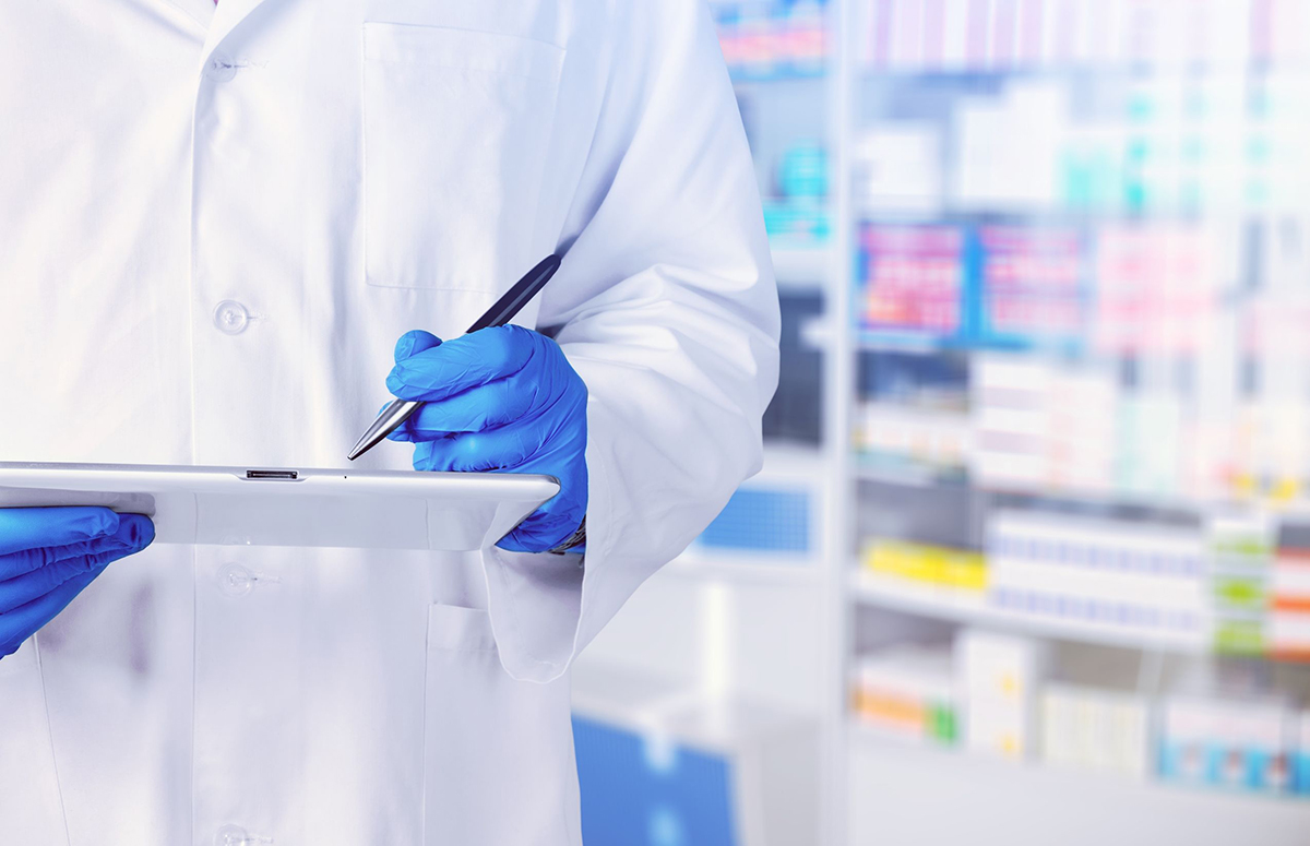 Pharmacy dispensing counter with neatly arranged prescription bottles at Ladner Drugs