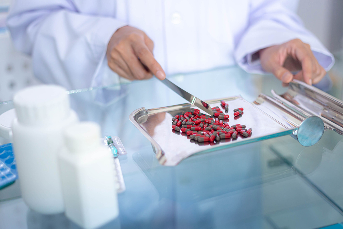 A Ladner Drugs pharmacist consulting with a patient about their medications