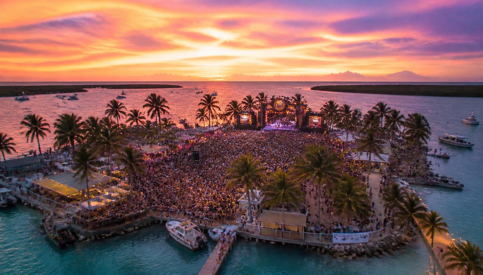 Island festival grounds at sunset