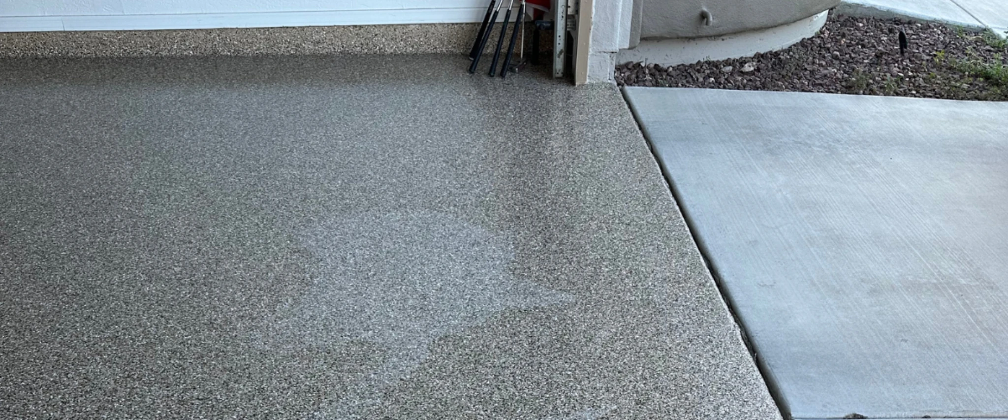 Epoxy flake coating on patio area adjacent to a concrete driveway. Epoxy flake coating on patio area adjacent to a concrete driveway.
