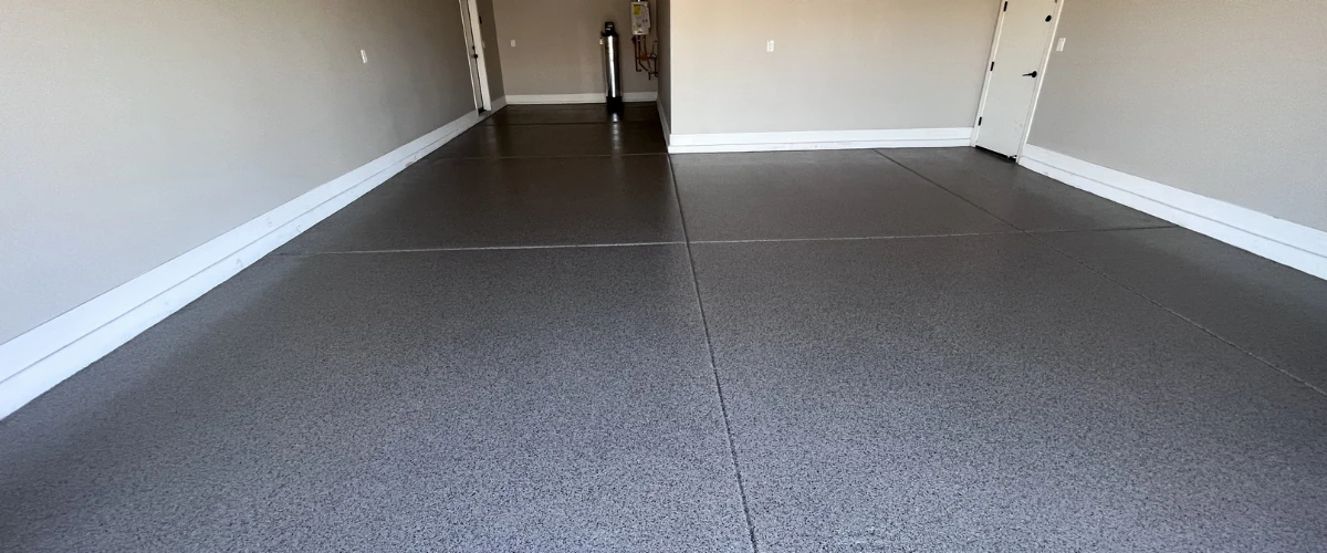 Two-car garage with a durable speckled epoxy floor coating. Two-car garage with a durable speckled epoxy floor coating.
