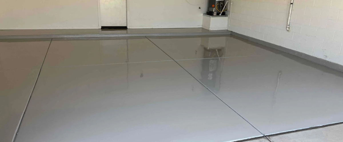 Light gray epoxy garage floor with a glossy, seamless finish.