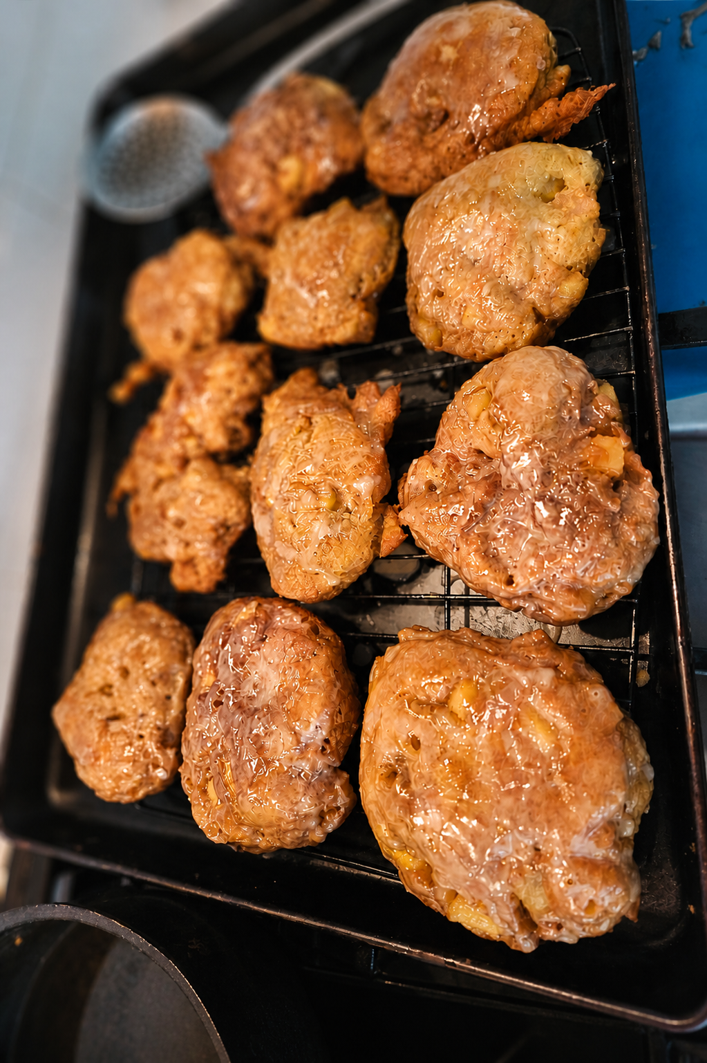 Fresh homemade apple fritters with glaze made from scratch by Mariposas Fresh homemade apple fritters with glaze made from scratch by Mariposas