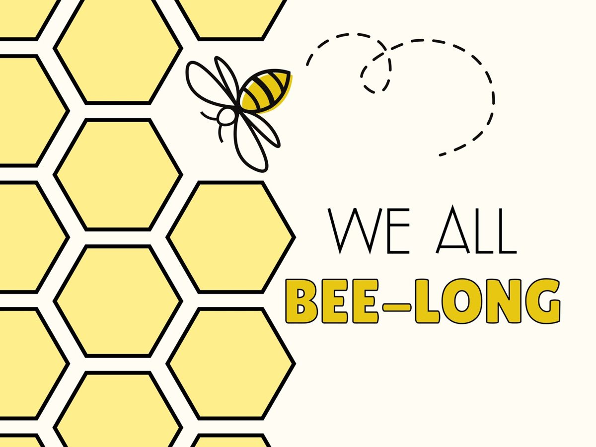A bee flying beside a honeycomb, with the words: We all bee-long