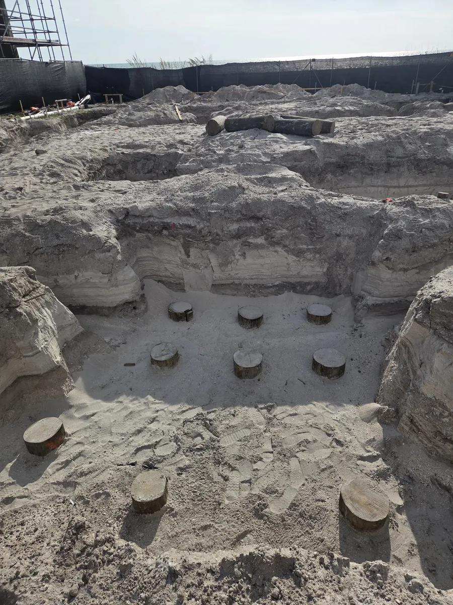 Pile caps set in sand in an excavated foundation on a coastal site