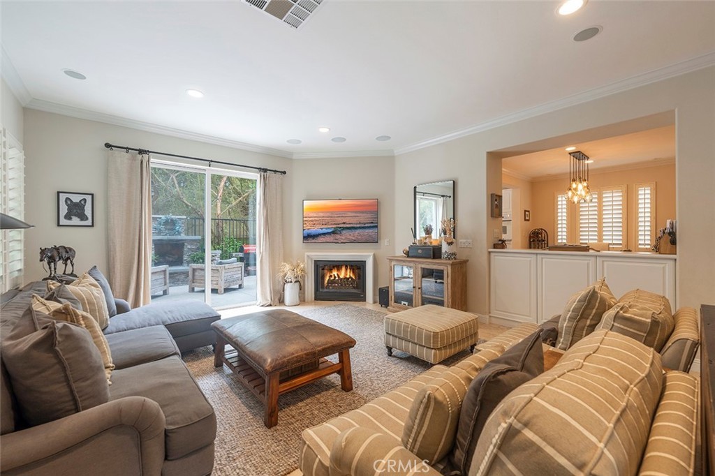 Living room with fireplace arranged for listing photography