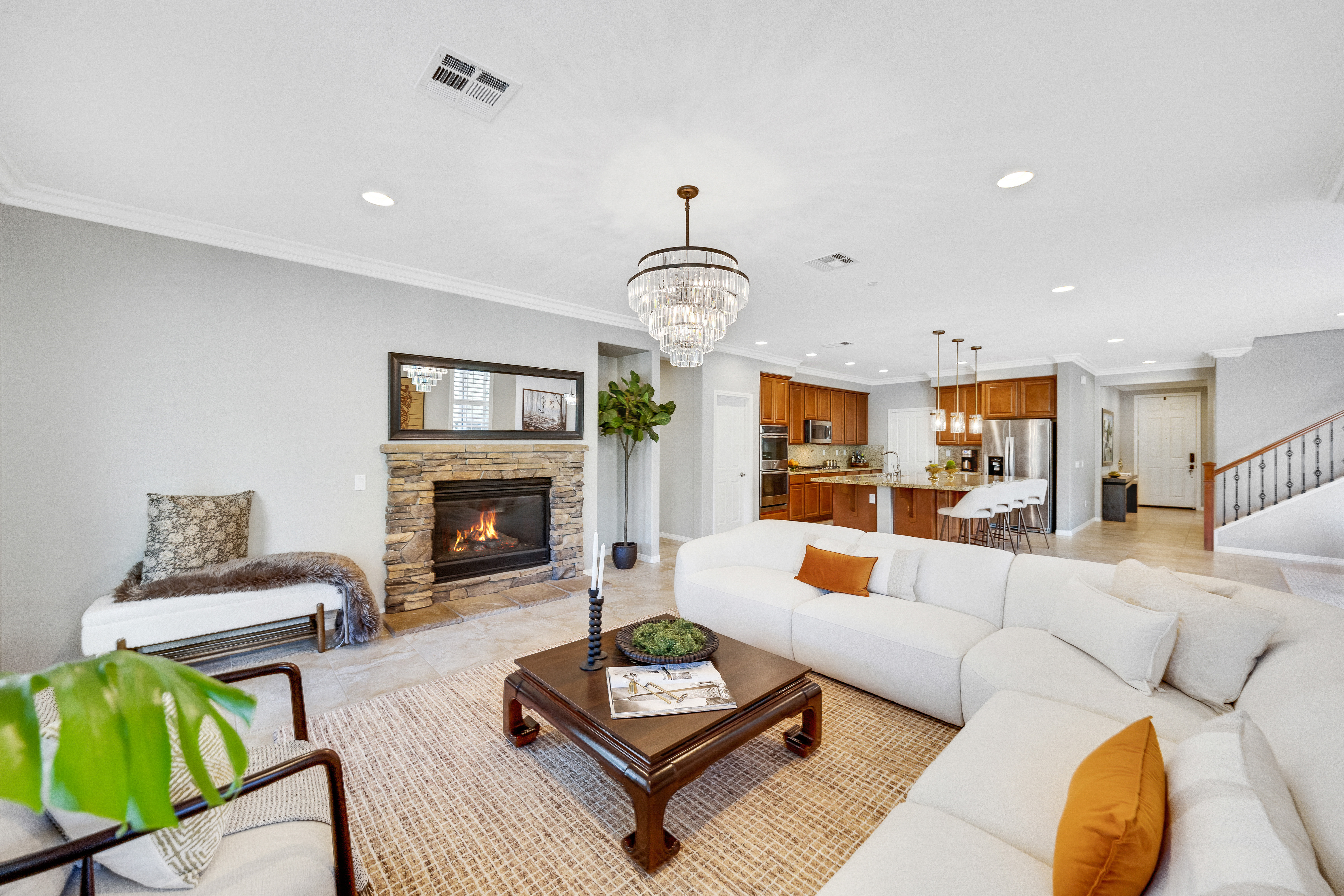 Living room with fireplace and chandelier