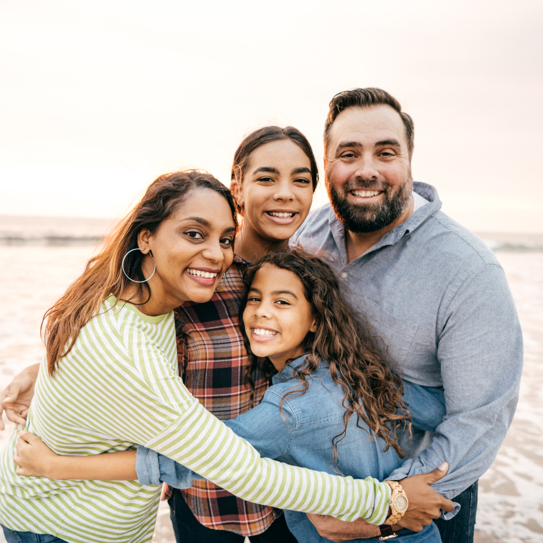 Family with two daughters at the beach