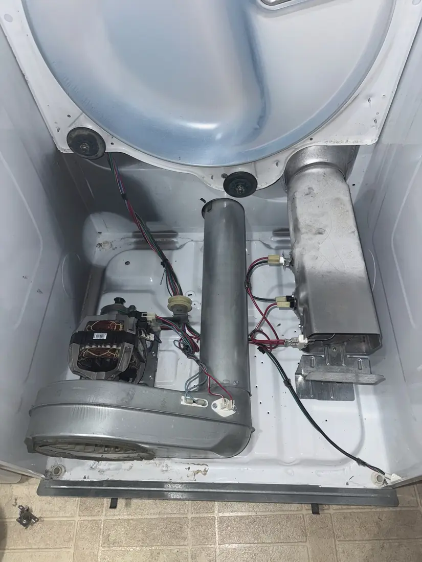 The same dryer after cleaning, with the motor, blower and heater housing clear of lint