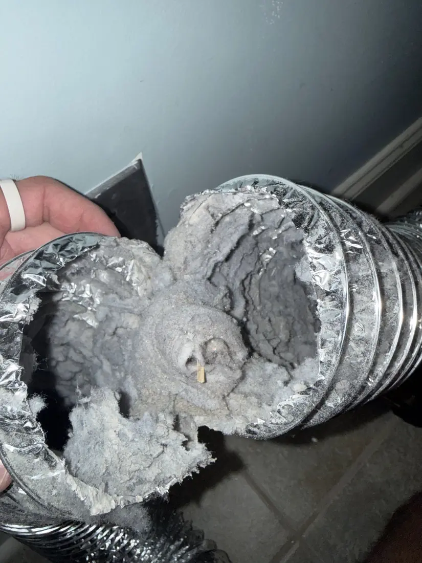 Dryer vent hose packed solid with lint