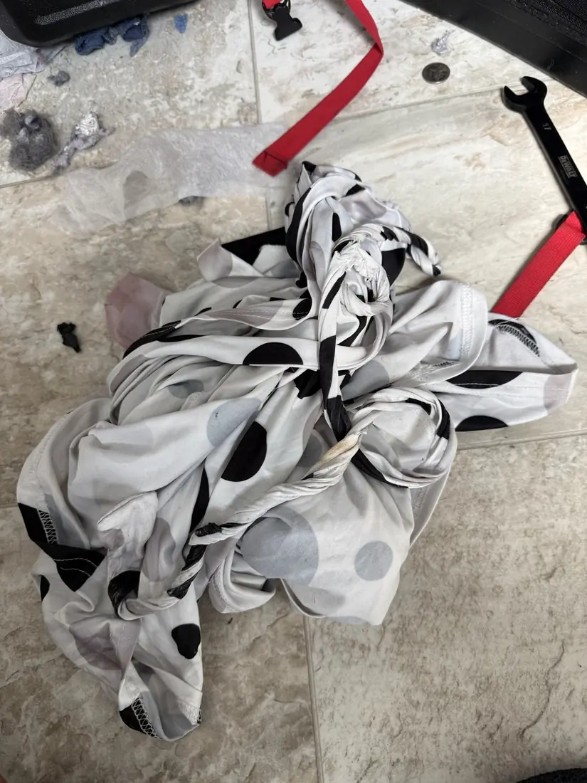 Polka-dot dress pulled out from inside a dryer