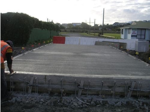 Reinforced concrete block retaining wall