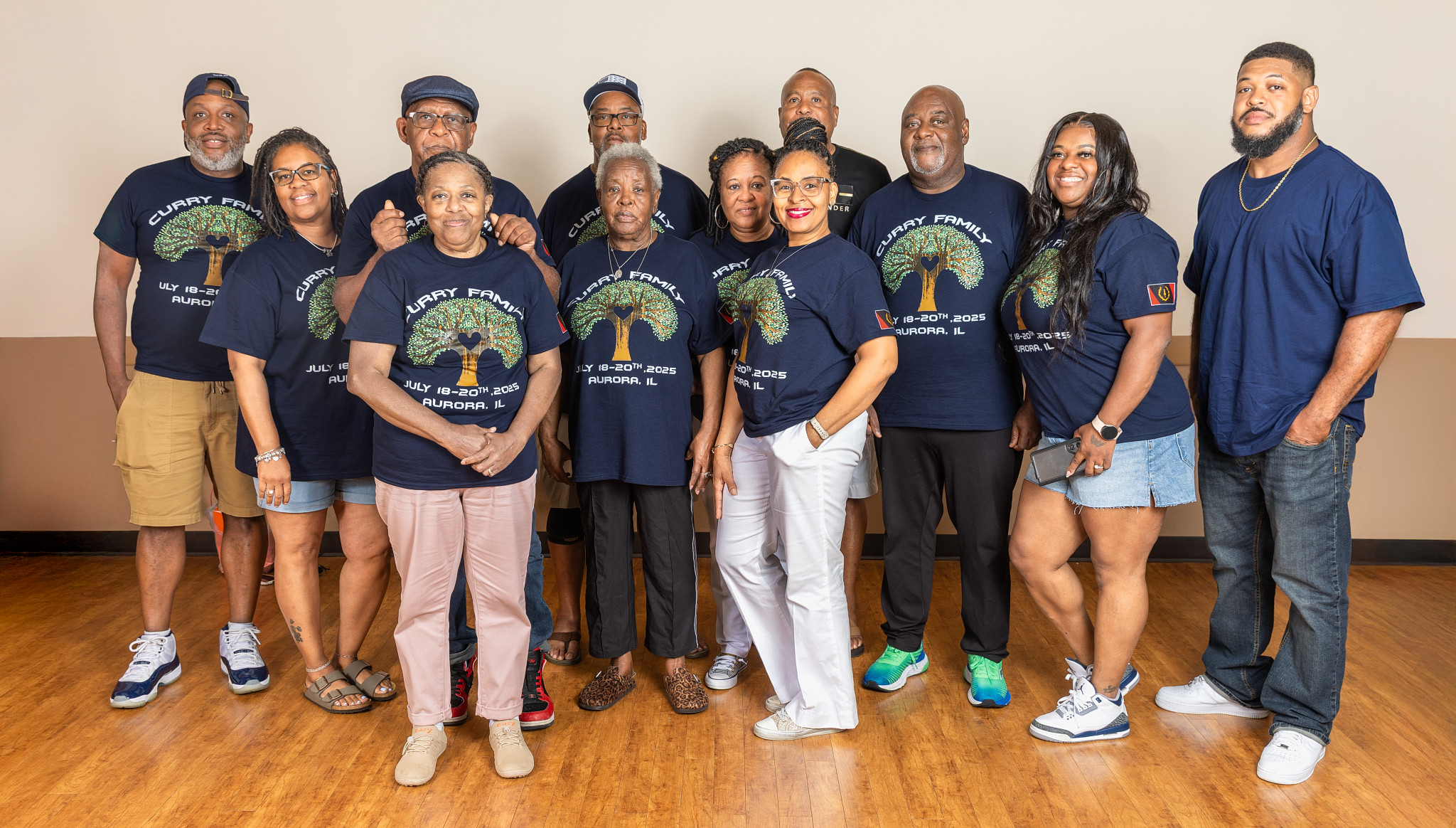 Curry family members standing together in matching reunion shirts