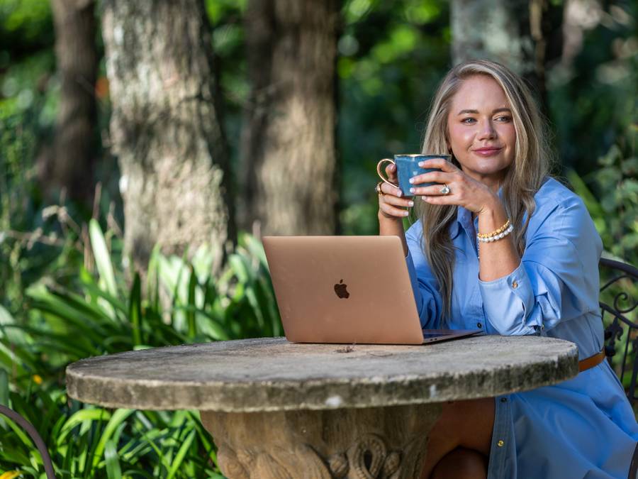 Michaela Sparrow, online naturopath and nutritionist, working outdoors in the garden