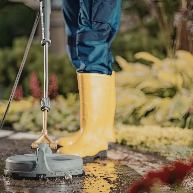 Close-up of pressure washing concrete driveway — power wash service in Inwood, Nassau County NY