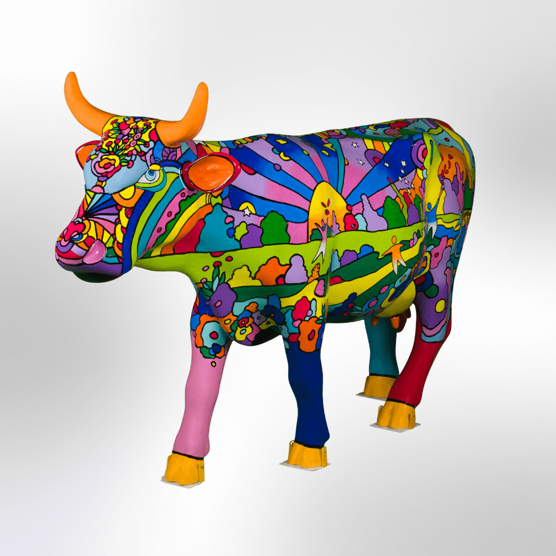 A colorful, pop art style cow featuring a sun, open field, people, trees, plants, and serene park scenes