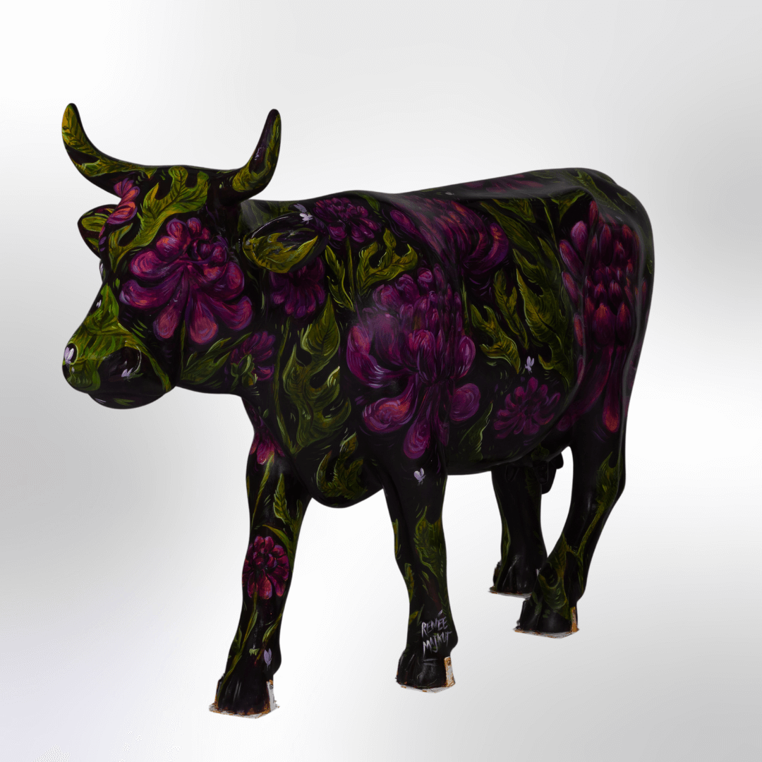 A dark cow painted in jewel tones featuring purple dahlia flowers 