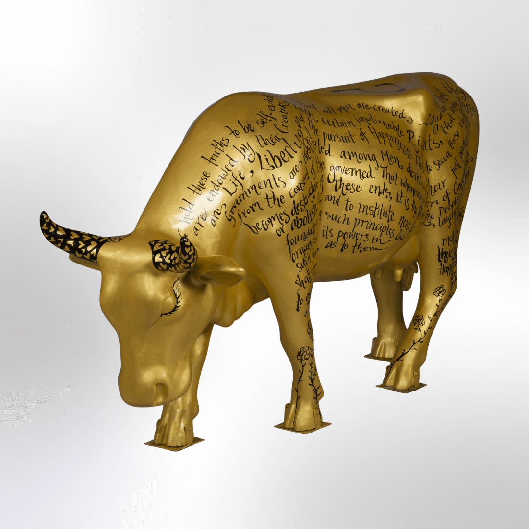 A golden cow covered in the words from the Declaration of Independence 