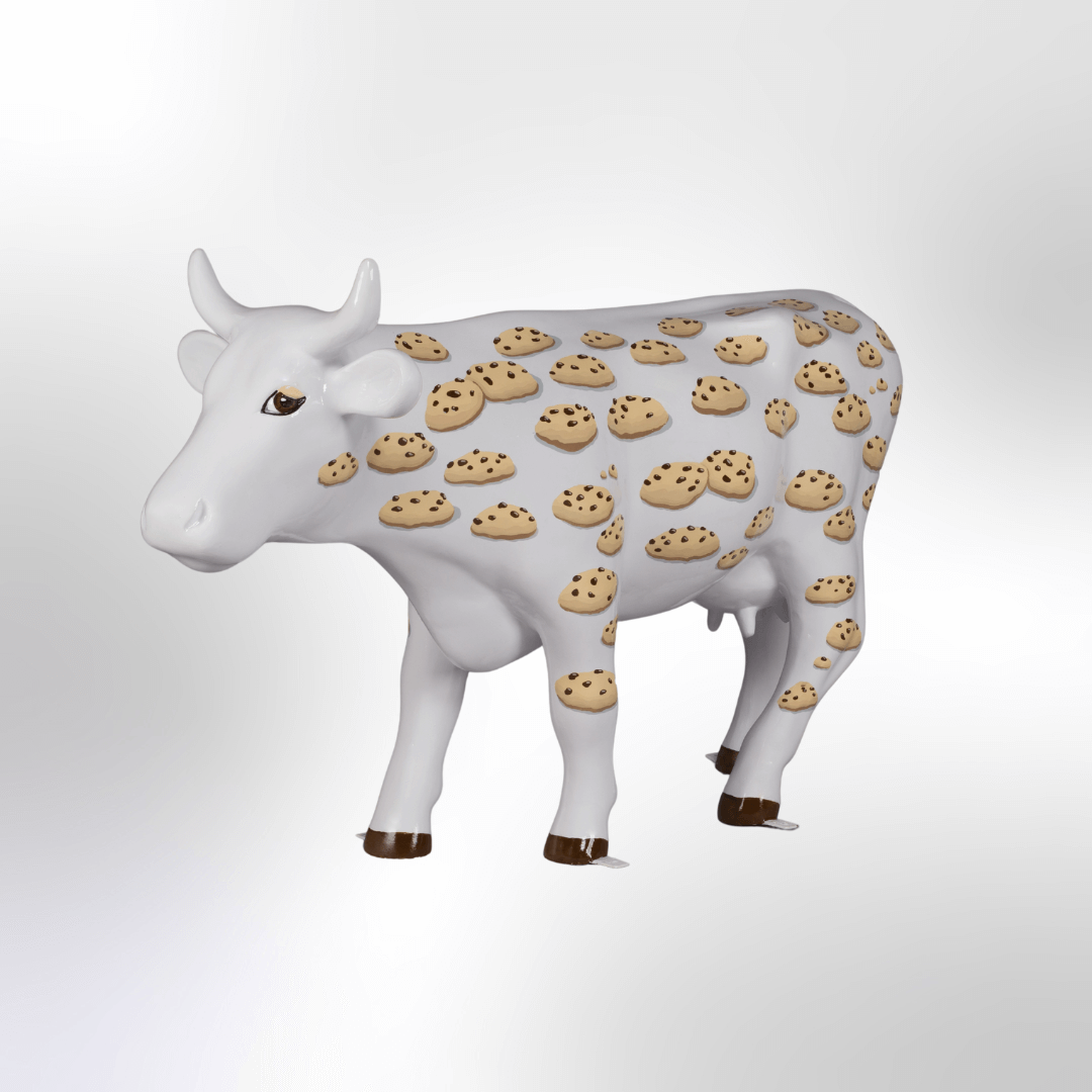 A white cow covered in chocolate chip cookies