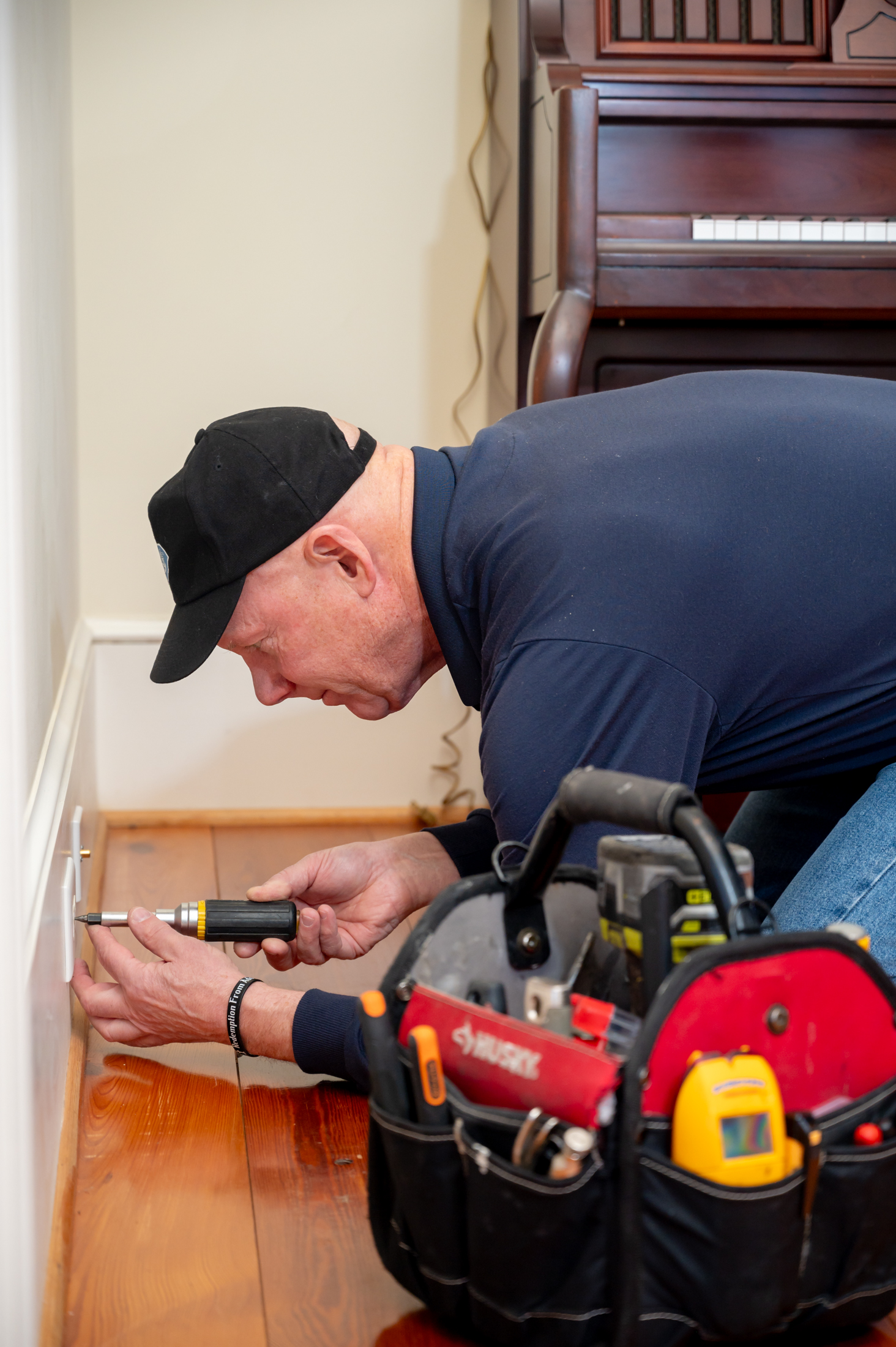 Mark Weir performing careful electrical work in a Greenville SC home