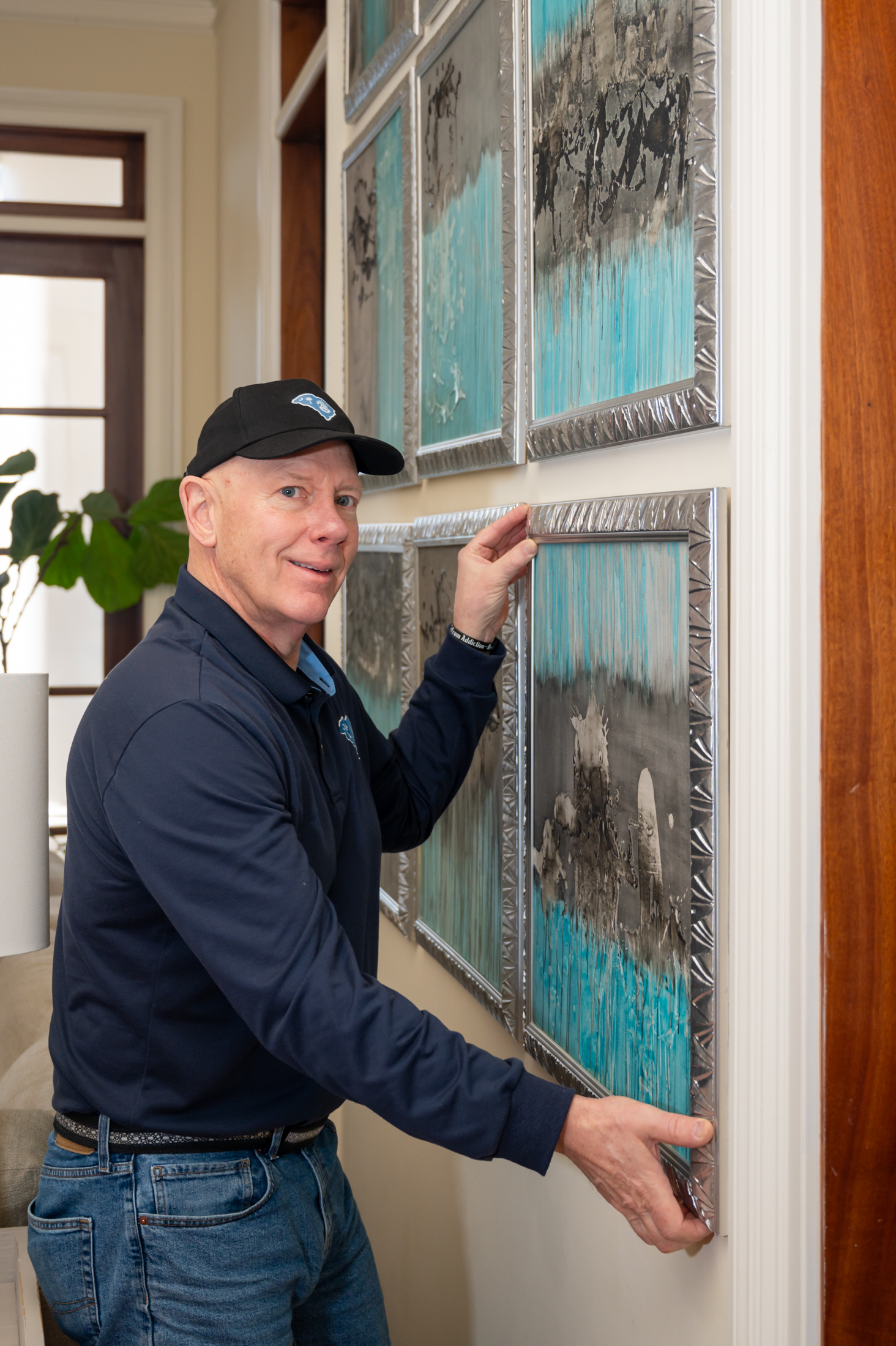 Mark Weir installing hardware in a Greenville SC home