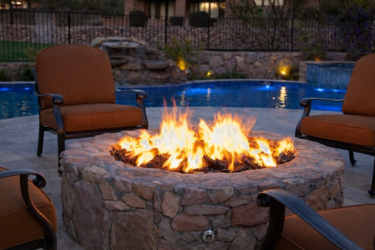 Outdoor fire pit at dusk with ambient evening lighting